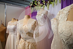 Wedding dresses on hangers and dummies