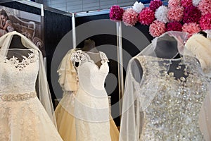 Wedding dresses on hangers and dummies