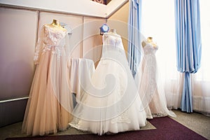 Wedding dresses presented on a fashion exhibition. photo
