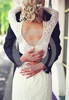 Wedding elegant couple hugging, lace bridal dress