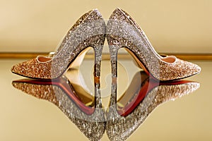Wedding elegante luxury shoes on a mirror table, selective focus photo