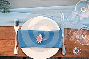 Wedding or Event decoration table setup, blue napkin, outdoor