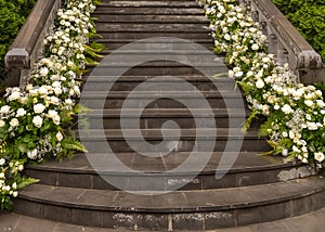 wedding exterior in the bride\'s house with white floral decor