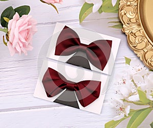 Wedding fashion accessories.Red bow tie on a wooden background