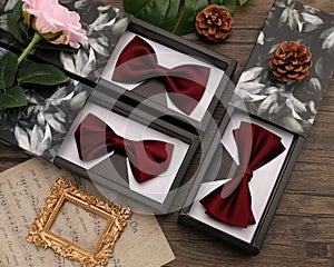 Wedding fashion accessories.Red bow tie on a wooden background
