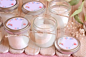 Wedding favors glass jar custom candles for party guests on favor wood table in natural and white colors