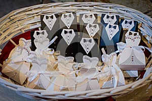 Wedding favors for the guests in a wicker basket.