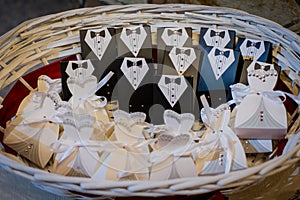 Wedding favors for the guests in a wicker basket. photo