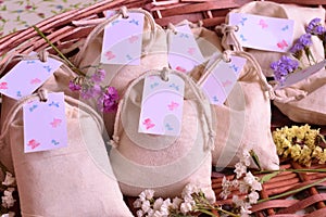 Wedding favours cotton bags scented sachets, party small guest gifts in brown wicker basket