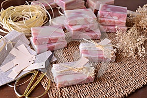 Wedding favours making pink color handmade soaps decoration with jute and white flowers