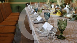 Wedding festive table with decor and flowers in the restaurant
