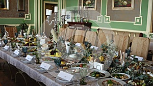 Wedding festive table with food, decor and flowers in a restaurant