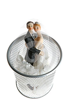 Wedding figurine on the paper trash