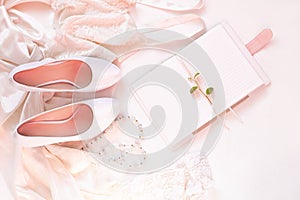 Wedding flat lay, womans stylish fashion accessories in biege colors, white background,copy space.Bridal details concept