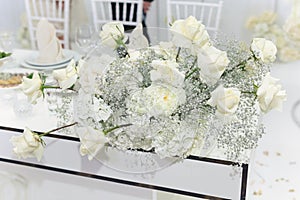 Wedding floral decor in white at a banquet in a restaurant