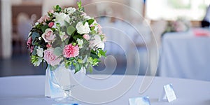 Wedding floristry. Beautiful lush bouquet on the table in restaurant