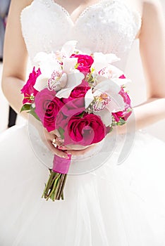 Wedding flower bouquet with pink roses and white callas