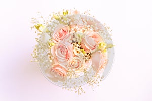 Wedding flower bouquet in soft pastel colors on the offwhite background flat lay top vies from above photography image