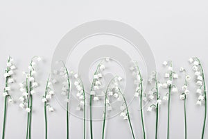 Wedding flower frame on light table from above. Flat lay style.