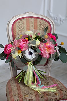 Wedding flowers bouqete on the chair