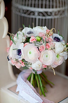 Wedding flowers bouqete near the cage