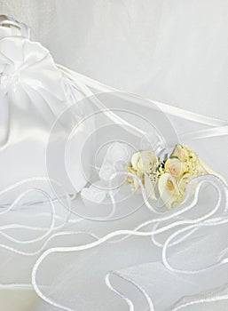 Wedding flowers and bridal bag over veil