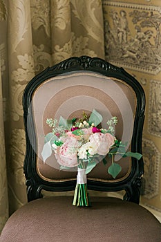 Wedding flowers on the brown chair