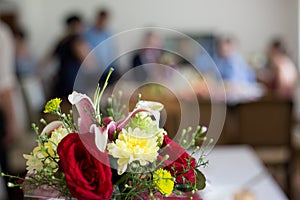 Wedding flowers in front of people