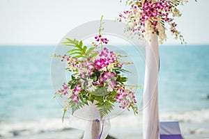 Wedding flowers setting on the beach.