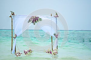 Wedding Gazebo Tropical Flower Setup on water Lagoon in Maldives.