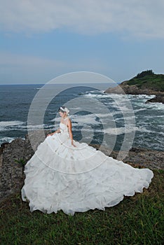 Wedding girl at cliff