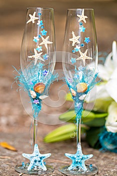 Wedding glasses for champagne and bridal bouquet
