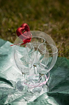 Wedding glasses with a decor in the form of volume red heart