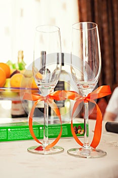 The wedding glasses decorated with a bow