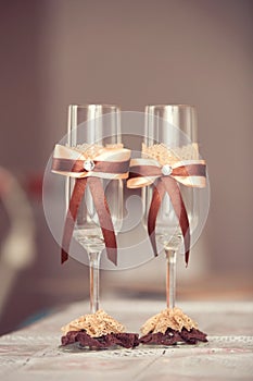 The wedding glasses decorated with a bow