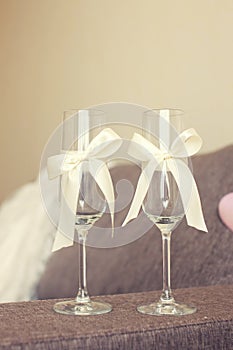 The wedding glasses decorated with a bow