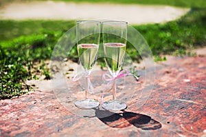 Wedding glasses with pink ribbons