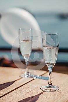 Wedding glasses and rings. Wedding glasses with sparkling champagne and rings inside