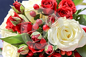 Wedding gold ring on wedding bouquet