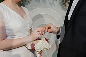 Wedding gold rings on the hands of the newlyweds. Gold rings on the hand of a man and a woman