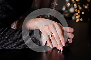 Wedding gold rings on the hands of the newlyweds. Gold rings on the hand of a man and a woman