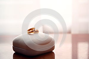 Wedding gold rings lie on a box photo