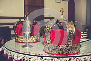 Wedding golden crowns and chalice