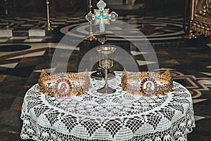 Wedding golden crowns and chalice