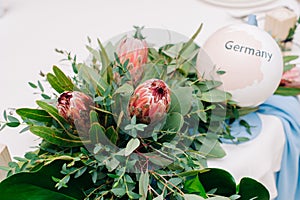 Wedding guest table decorated with bouquet and settings