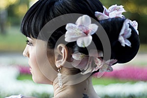 Wedding hairdo on black hair with flowers