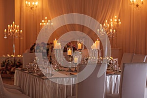 Wedding hall decoration with crystal chandeliers and candles