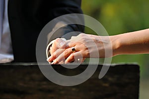 Wedding hands bride and groom