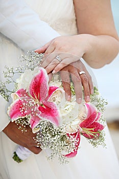 Wedding Hands and Rings on Bouquet - Tropical