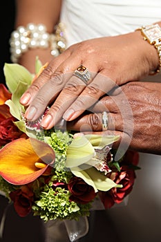 Wedding Hands and Rings on Tropical Bouquet